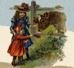 Two girls feeding a cow