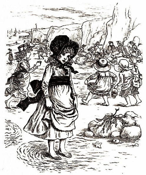 Little girl at the beach with many other children