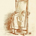 Little girl looking in the mirror