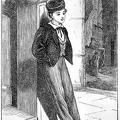 Young boy standing on the street corner