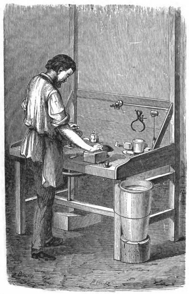 Workman fashioning a spectacle lens.jpg