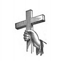 Hand holding a small cross