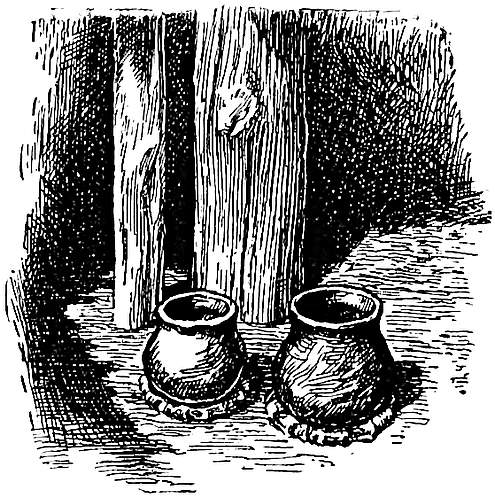 An earthen pot full of water stood by one of the posts near the fire.jpg